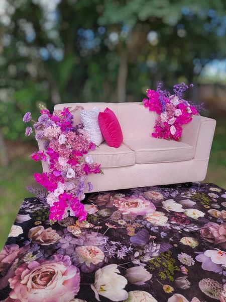 Ivory Tufted Sofa with Floral Decor